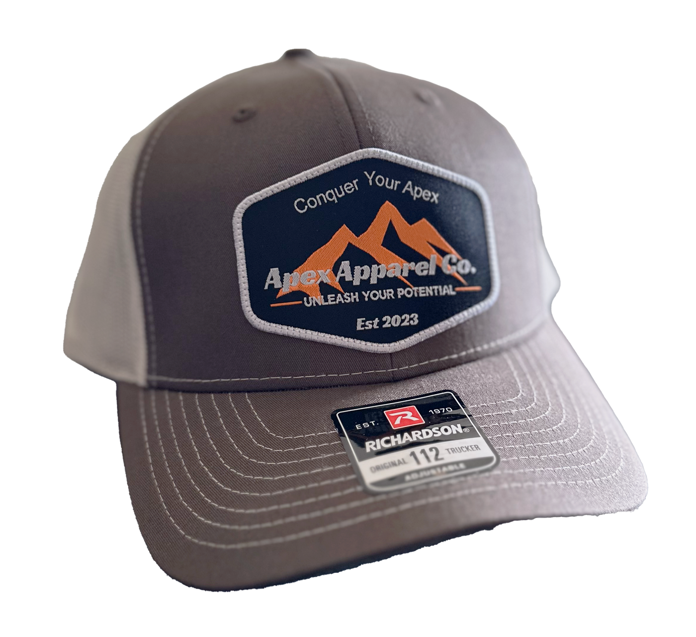 Apex Apparel Co original trucker hat in brown and khaki, showcasing adjustable snapback and classic mesh design.
